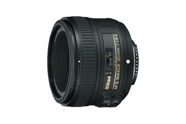 A black, slightly shorter DSLR camera lens with printed text in gold. Its height is slightly more than its width and depth.